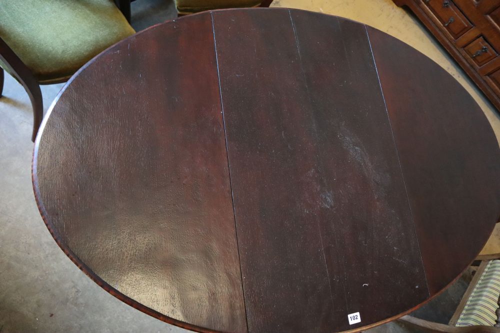 A 1920s oak gateleg table, with spiral twist underframe, width 91cm